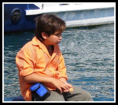 WAITING BOY BY THE SEA - By Anthony Buccino, Maori Italy, seaside, boy on dock