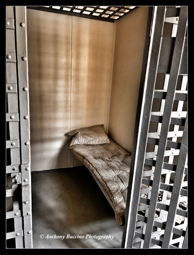 Jail Cell with Pillow, Fort Hancock Museum jail at Sandy Hook NJ by Anthony Buccino, May 2024